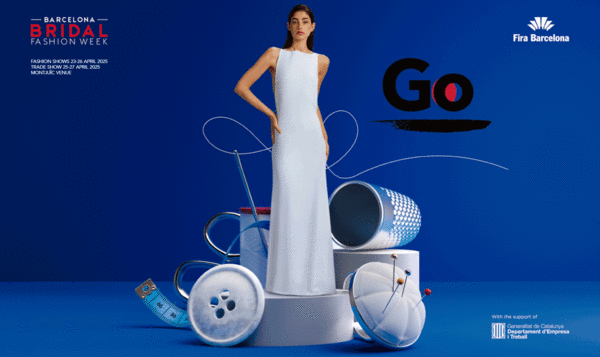 Model wearing a wedding dress standing on a pedestal wrapped in giant fashion design elements