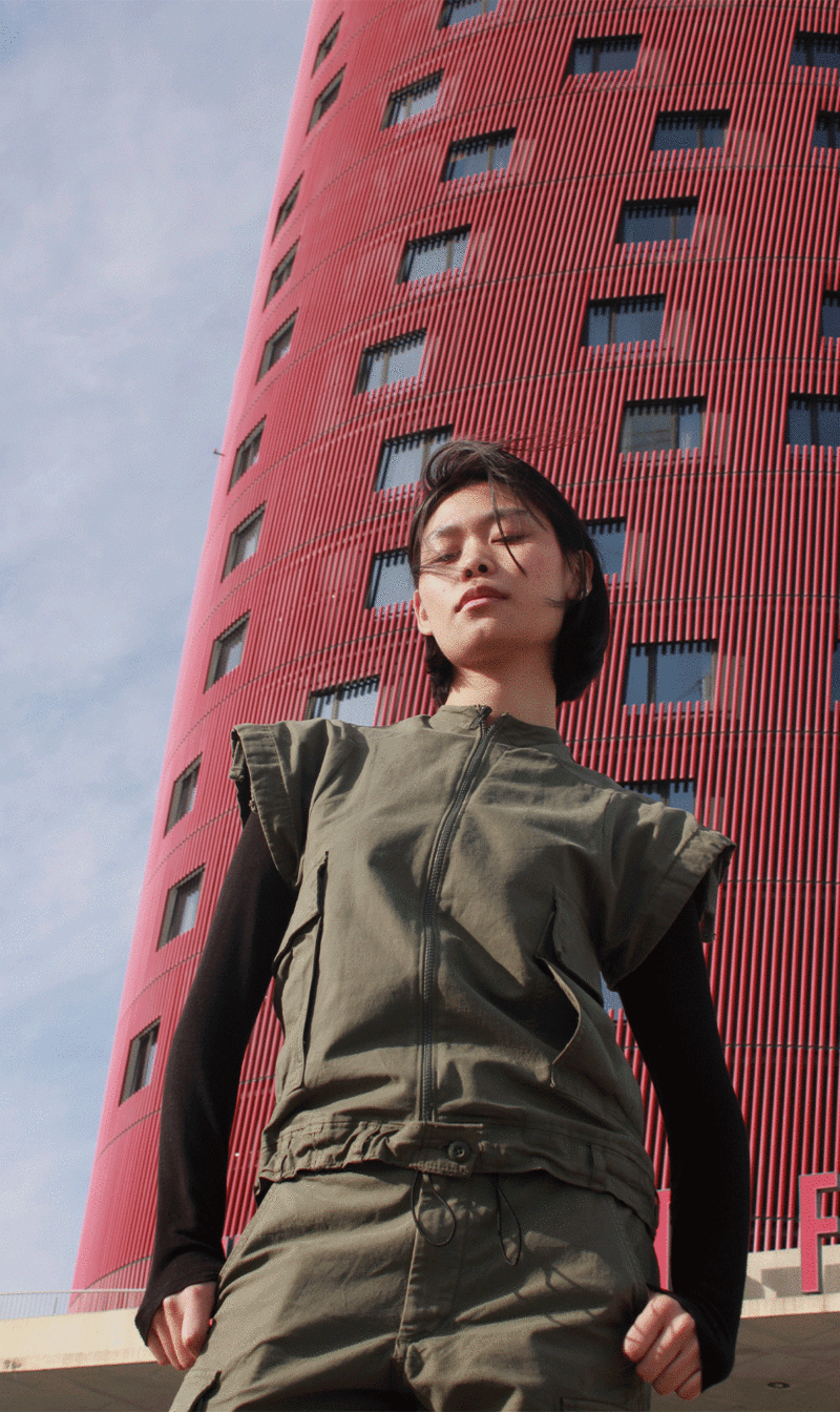A model wearing a cargo vest inspired by Japanese architect Toyo Ito