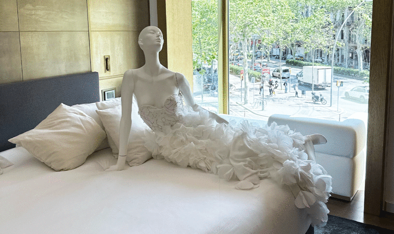 Bridal design on a mannequin on a hotel room bed