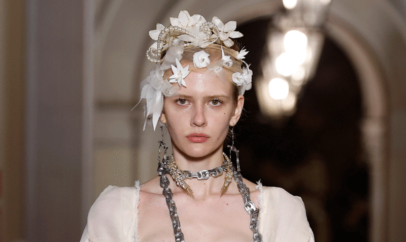 Model wearing a bridal accessory (tulle strip with flowers) designed by IED Barcelona students for Vivienne Westwood
