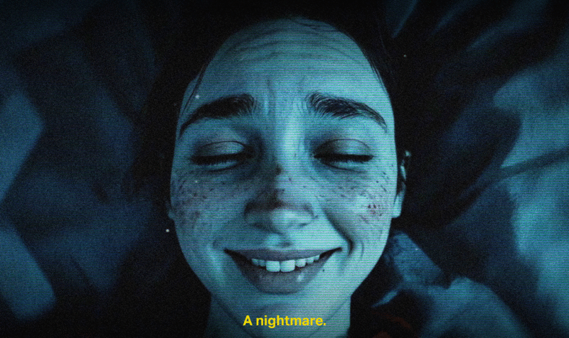Frame showing a close-up of a girl's smiling face lying on a bed, illuminated in blue tones.