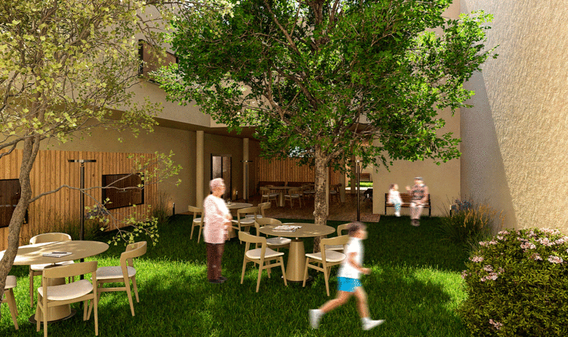 Two elderly people with their grandchildren in an interior garden of a residence, with tables in the center and vegetation on the sides