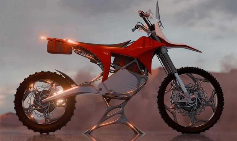 Red and white off-road electric motorcycle in a desert landscape seen from the side with the parking lights and headlights on.