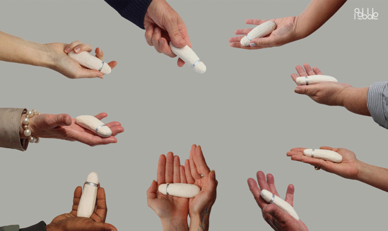 Several hands forming a circle on a gray background and showing a small AIG device
