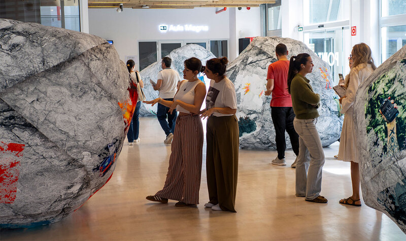 People visiting an art and design exhibition