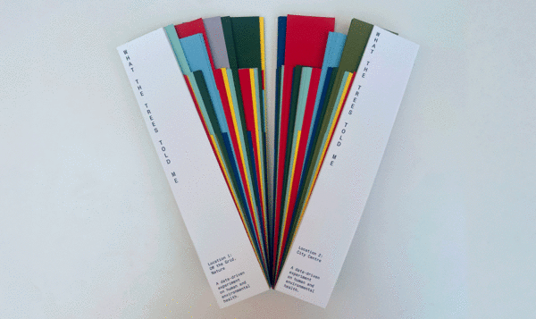 Two catalogues of coloured strips displayed in a fan-shaped arrangement